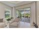 View of the screened-in outdoor patio with furniture and a view of the backyard at 11685 Great Brook Ln, Parrish, FL 34219
