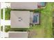 Birds eye view of the home showing the roof and screened in pool area at 12564 Night View Dr, Sarasota, FL 34238