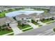 Beautiful aerial view of homes with a serene lake adding to the landscape's tranquility at 12564 Night View Dr, Sarasota, FL 34238