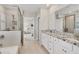 Modern bathroom with granite counters, double sinks, and a glass-enclosed shower at 12564 Night View Dr, Sarasota, FL 34238