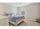 Bright bedroom with a ceiling fan, neutral walls, a window, and carpeted floors at 12564 Night View Dr, Sarasota, FL 34238