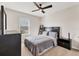 Modern bedroom with a ceiling fan, neutral walls, a window, and carpeted floors at 12564 Night View Dr, Sarasota, FL 34238