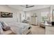 Relaxing bedroom with soft lighting, calming artwork, and comfortable furnishings at 12564 Night View Dr, Sarasota, FL 34238