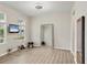Bright bonus room with wood floors, barre, mirror, tv and workout equipment at 12564 Night View Dr, Sarasota, FL 34238