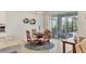 Bright dining area with round wood table and seating for four, with a view of the screened-in patio at 12564 Night View Dr, Sarasota, FL 34238