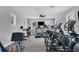 A well-equipped fitness center with modern exercise machines and lots of natural light from windows at 12564 Night View Dr, Sarasota, FL 34238