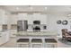 Modern kitchen with stainless steel appliances, granite countertops, and ample cabinet space at 12564 Night View Dr, Sarasota, FL 34238