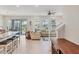 Open-concept living space featuring lots of natural light and easy access to outdoor spaces at 12564 Night View Dr, Sarasota, FL 34238