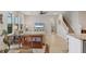 Bright living room featuring stylish decor, cozy seating, and a staircase leading upstairs at 12564 Night View Dr, Sarasota, FL 34238