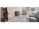 Spacious living room with arcade game and stylish decor, ideal for entertaining guests at 12564 Night View Dr, Sarasota, FL 34238