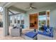 Enjoy the outdoor patio with comfortable seating, a ceiling fan, and access to the pool and lake at 12564 Night View Dr, Sarasota, FL 34238