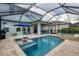 Backyard oasis, screened pool, hot tub, patio, and shaded lounge area at 12564 Night View Dr, Sarasota, FL 34238