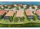 Desirable waterfront home in Nokomis, Florida, with lush landscaping and breathtaking water views on a clear day at 138 Toscavilla Blvd, Nokomis, FL 34275