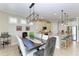 Dining room showcasing a stylish chandelier and an open concept design at 138 Toscavilla Blvd, Nokomis, FL 34275