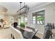 Open dining room with views of the lake and access to the living area at 138 Toscavilla Blvd, Nokomis, FL 34275
