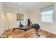 Home gym with hardwood floors, rowing machine, ample natural light, and ceiling fan at 138 Toscavilla Blvd, Nokomis, FL 34275