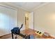 Home gym featuring hardwood floors, a rowing machine, a closet, and access to other rooms at 138 Toscavilla Blvd, Nokomis, FL 34275