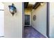Inviting front entrance with brick paver floor and decorative wall sconce at 138 Toscavilla Blvd, Nokomis, FL 34275