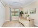 Inviting home office with neutral walls, tile floors, large desk, and bright natural light at 138 Toscavilla Blvd, Nokomis, FL 34275