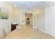 Bright home office with tile floors and French doors leading to the main living area at 138 Toscavilla Blvd, Nokomis, FL 34275