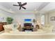 Bright living room featuring tile floors, textured wall, and modern furnishings at 138 Toscavilla Blvd, Nokomis, FL 34275