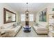 Comfortable living room with neutral colors, stylish decor, and lots of light at 138 Toscavilla Blvd, Nokomis, FL 34275