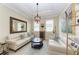 Comfortable living room with neutral colors, stylish decor, and lots of light at 138 Toscavilla Blvd, Nokomis, FL 34275