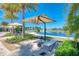 Relax poolside with waterfront views and plenty of space for lounging and soaking up the sun at 138 Toscavilla Blvd, Nokomis, FL 34275