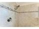 Shower with tiled walls, two shower heads, and corner seat at 138 Toscavilla Blvd, Nokomis, FL 34275