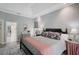 A cozy bedroom features soft natural light, neutral colors, and French doors at 140 Sugar Mill Dr, Osprey, FL 34229