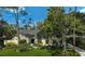 Charming home featuring lush landscaping, a well-manicured lawn, and a welcoming entrance at 140 Sugar Mill Dr, Osprey, FL 34229