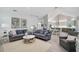 Open-concept living room with vaulted ceilings and lots of natural light at 140 Sugar Mill Dr, Osprey, FL 34229