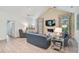 Cozy living room with a fireplace, soft lighting, and comfortable seating at 140 Sugar Mill Dr, Osprey, FL 34229