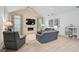 Comfortable living room with a fireplace, vaulted ceiling, and neutral color scheme at 140 Sugar Mill Dr, Osprey, FL 34229