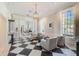 Elegant lobby with black and white checkered flooring and comfortable seating at 140 Sugar Mill Dr, Osprey, FL 34229