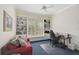 Office with bookshelves, a window, and a desk with a chair, providing a functional workspace at 140 Sugar Mill Dr, Osprey, FL 34229