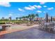 Outdoor patio with fire pit, patio furniture, and a clear view of the lush golf course at 140 Sugar Mill Dr, Osprey, FL 34229