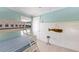 Bedroom with bunk beds, wood-look floors, and beach-themed decorations at 152 Coolidge Dr, Sarasota, FL 34236