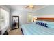 Serene bedroom with light blue walls, wood accents, and ample natural light at 152 Coolidge Dr, Sarasota, FL 34236