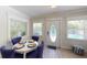 A bright dining area near the front door with great light and comfortable seating for four at 152 Coolidge Dr, Sarasota, FL 34236