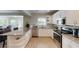 Modern kitchen with white cabinetry, granite countertops, and stainless steel appliances at 152 Coolidge Dr, Sarasota, FL 34236