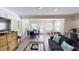 Charming living room featuring stylish decor, wood flooring, and comfortable seating for guests at 152 Coolidge Dr, Sarasota, FL 34236
