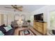 Cozy living room is highlighted by unique decor, including patterned armchairs and vintage furniture at 152 Coolidge Dr, Sarasota, FL 34236