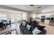 The open-concept living area boasts a comfortable couch and seamless flow to the modern kitchen at 152 Coolidge Dr, Sarasota, FL 34236