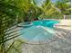 A luxurious pool area with spa provides a tranquil outdoor experience and ample patio space at 152 Coolidge Dr, Sarasota, FL 34236