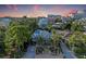 A beautiful property with lush tropical landscaping and views of the surrounding cityscape at 160 Coolidge Dr, Sarasota, FL 34236