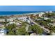 Beautiful coastal view showcasing beachfront access, lush greenery, and a serene ocean vista at 160 Coolidge Dr, Sarasota, FL 34236