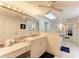 Charming bathroom vanity with a large mirror, Hollywood lighting, and decorative touches at 160 Coolidge Dr, Sarasota, FL 34236