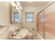 Cozy bathroom featuring a classic sink, mirror, and enclosed shower with pink trim at 160 Coolidge Dr, Sarasota, FL 34236