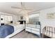 Comfortable bedroom featuring light gray floors, white walls and a mirrored closet at 160 Coolidge Dr, Sarasota, FL 34236